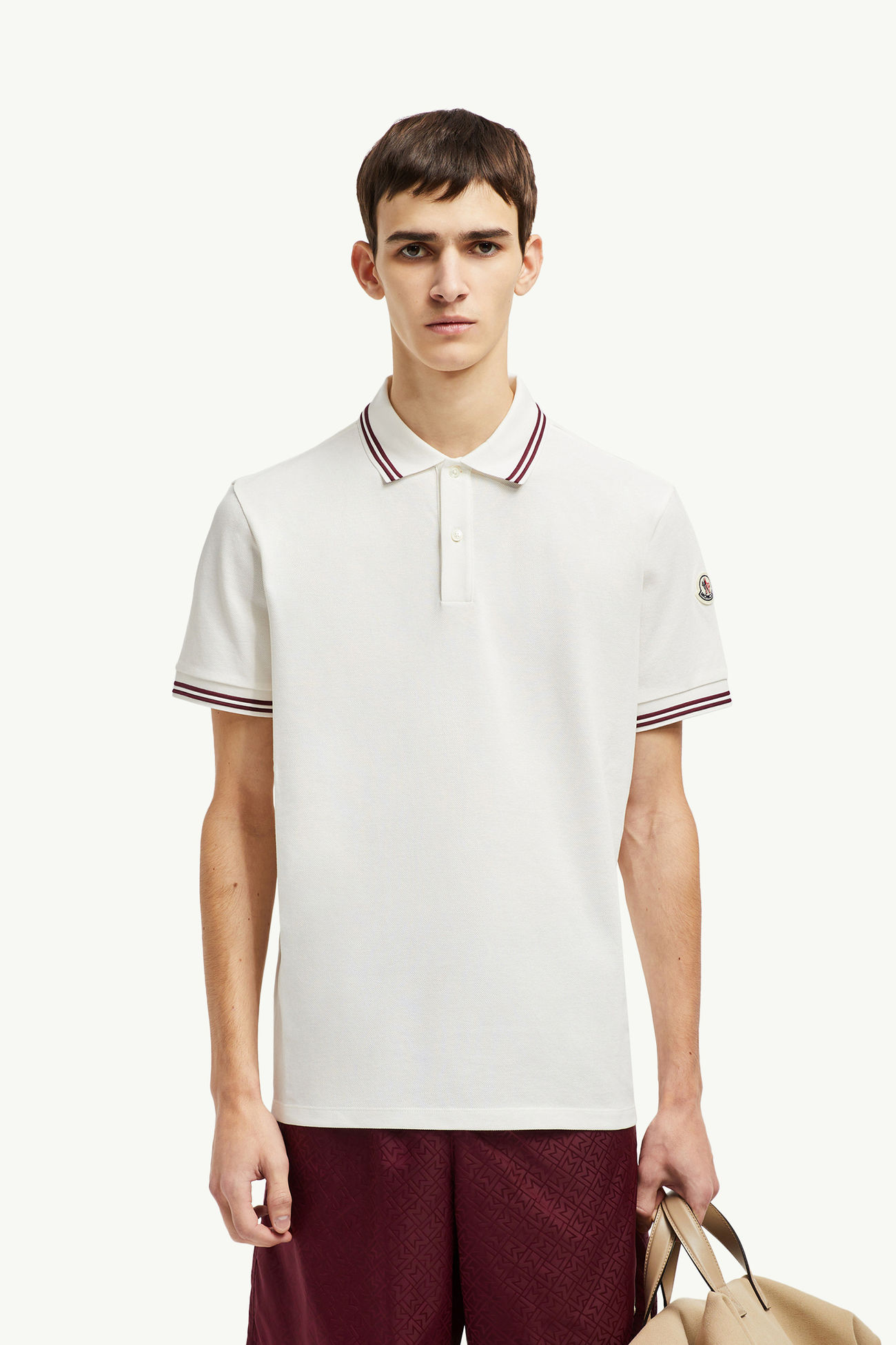 Polo in cotone piquet con orlo a righe Uomo Bianco Moncler 0