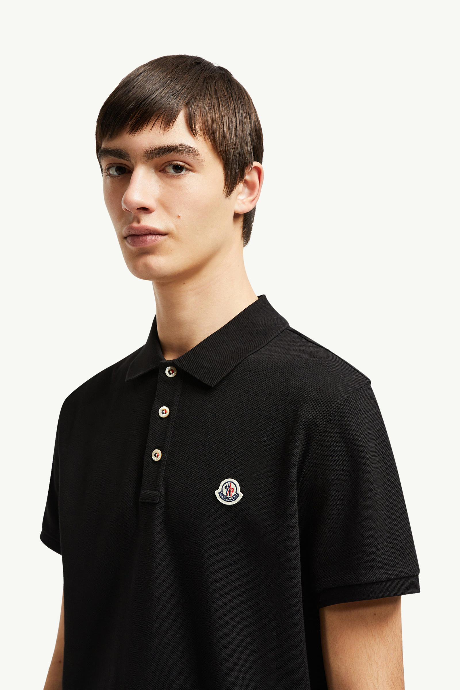 Polo in piquet di cotone con patch logato Uomo Nero Moncler 1
