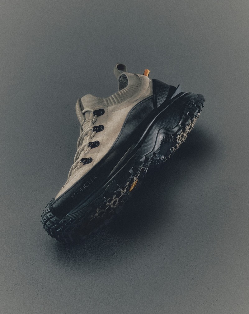 Moncler technical sneaker in beige and black with black rubber sole.