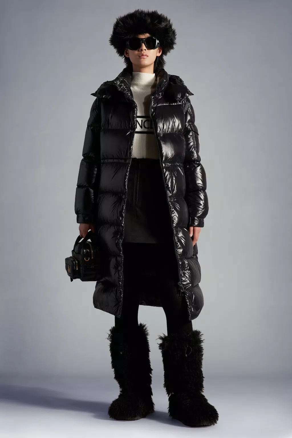 Unlock Wilderness' choice in the Moncler Vs North Face comparison, the Cavettaz Long Down Jacket by Moncler